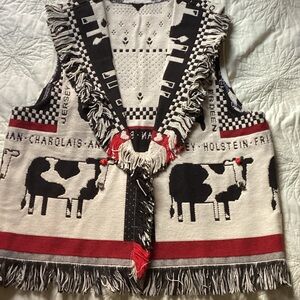 Cow Patterned vest with fringe.